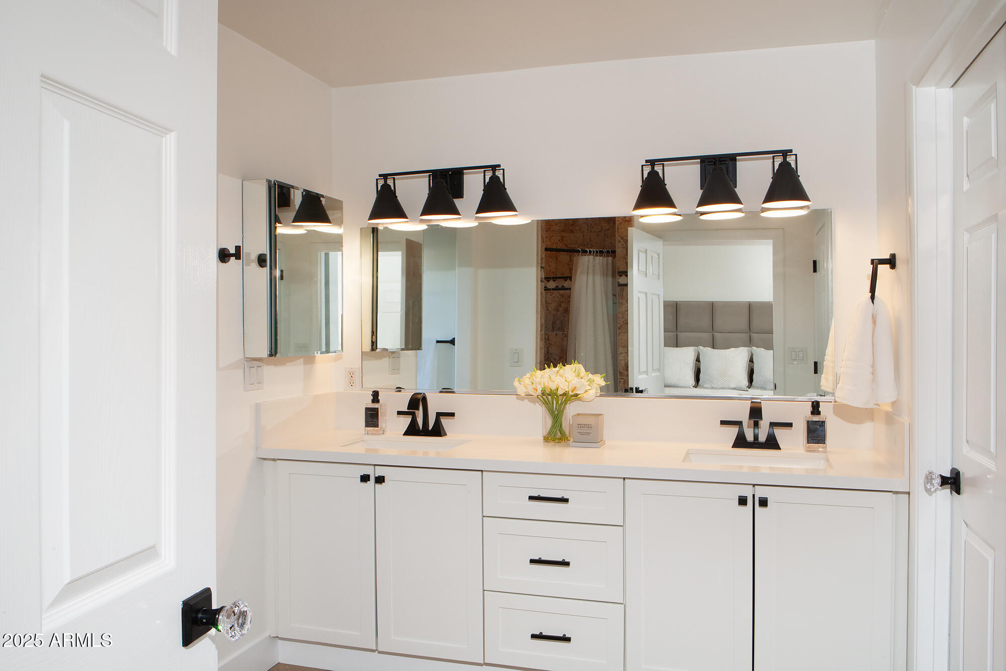6302 East Cochise Road Paradise Valley, AZ 85253 - Photo 30 of 44 a bathroom with double vanity sink a mirror and shower