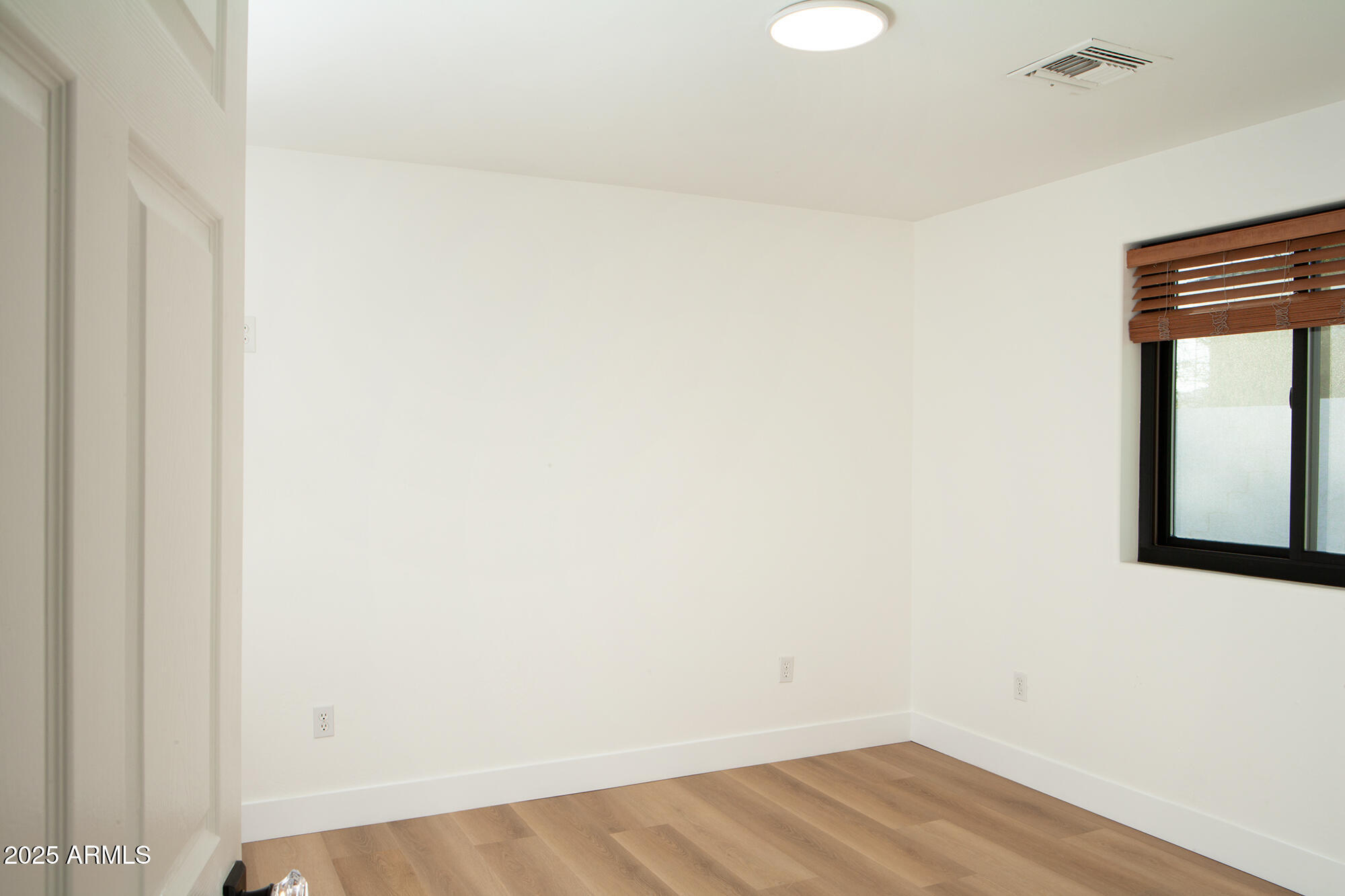 6302 East Cochise Road Paradise Valley, AZ 85253 - Photo 31 of 44 a view of a small space with wooden floor and a window
