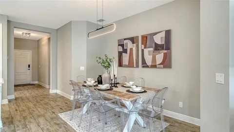 a dining room with furniture and window
