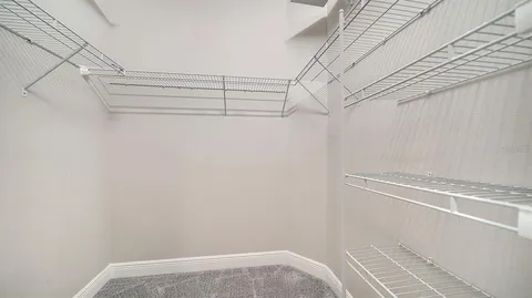 a view of a room with racks on the wall