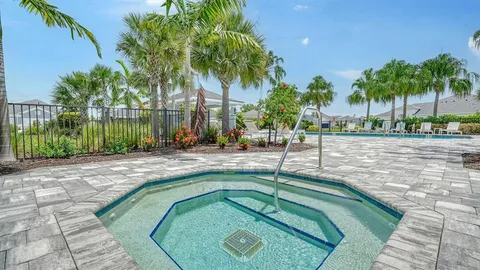 a swimming pool with outdoor seating and yard