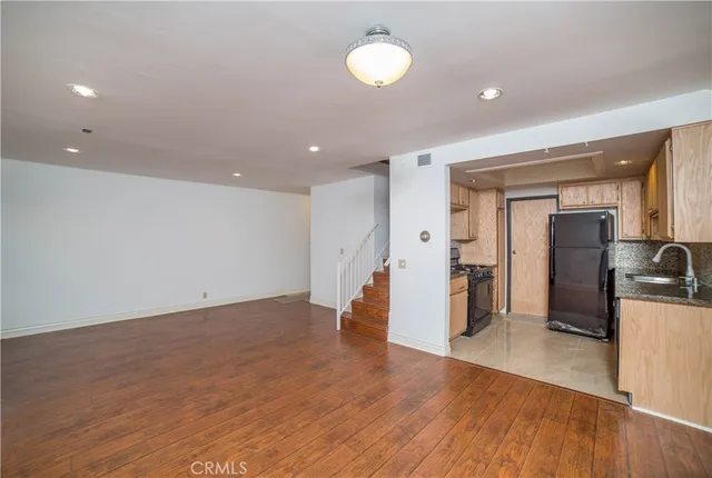 a kitchen that has a sink and cabinets
