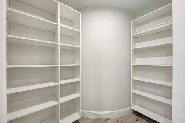 a large kitchen with kitchen island a sink a counter space and stainless steel appliances