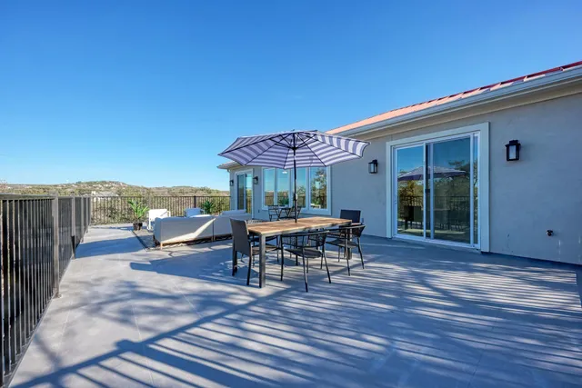 wooden floor in an empty room with a kitchen