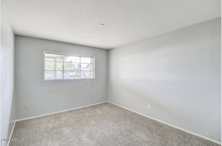 3249 West Citrus Way Phoenix, AZ 85017 - Photo 11 of 22 an empty room with a window