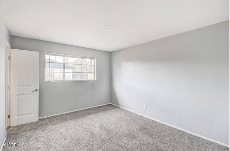 3249 West Citrus Way Phoenix, AZ 85017 - Photo 16 of 22 an empty room with windows