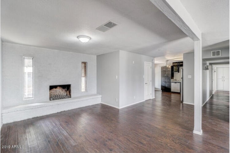 3249 West Citrus Way Phoenix, AZ 85017 - Photo 5 of 22 a view of a livingroom with a fireplace
