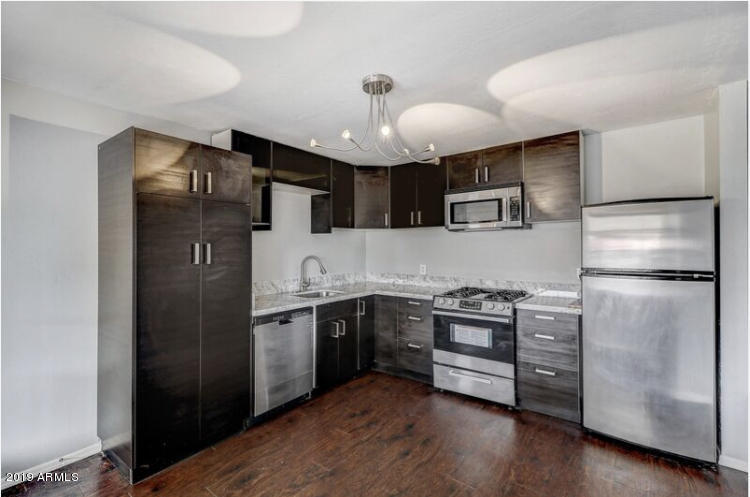 3249 West Citrus Way Phoenix, AZ 85017 - Photo 7 of 22 a kitchen with stainless steel appliances granite countertop a refrigerator a stove a sink and a refrigerator