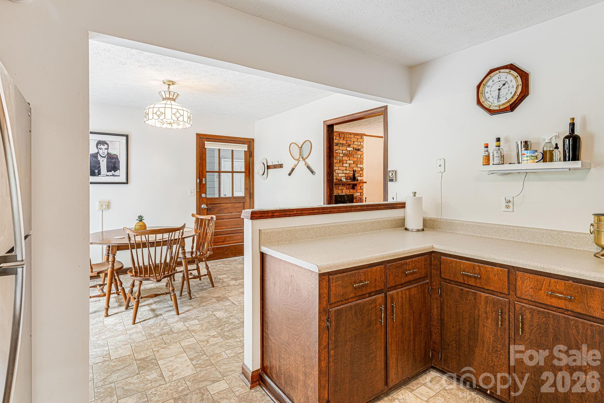 61 Spring Cove Drive Brevard, NC 28712 - Photo 13 of 39 a kitchen with a cabinets and chairs