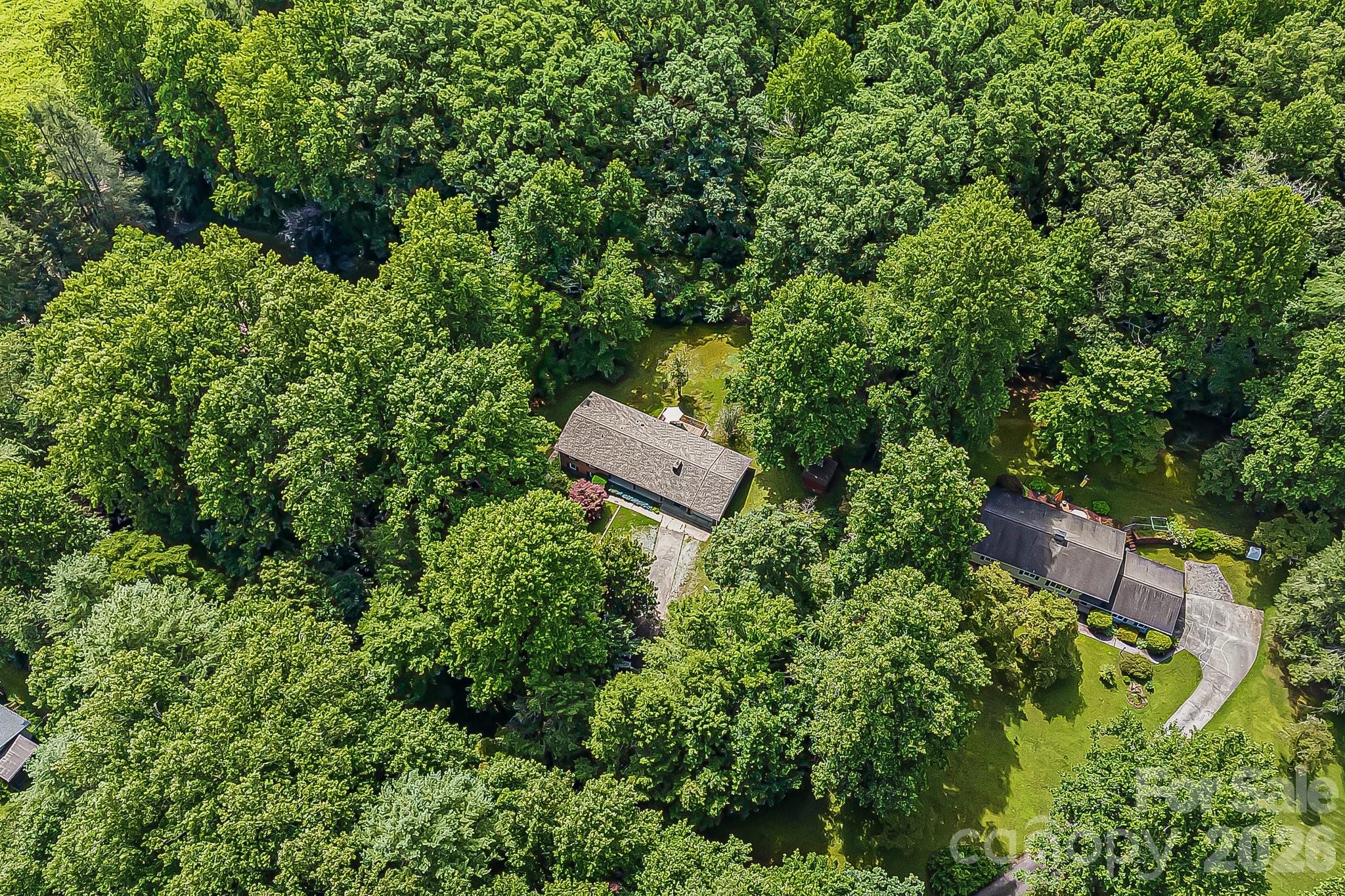 61 Spring Cove Drive Brevard, NC 28712 - Photo 34 of 39 an aerial view of a house with a yard