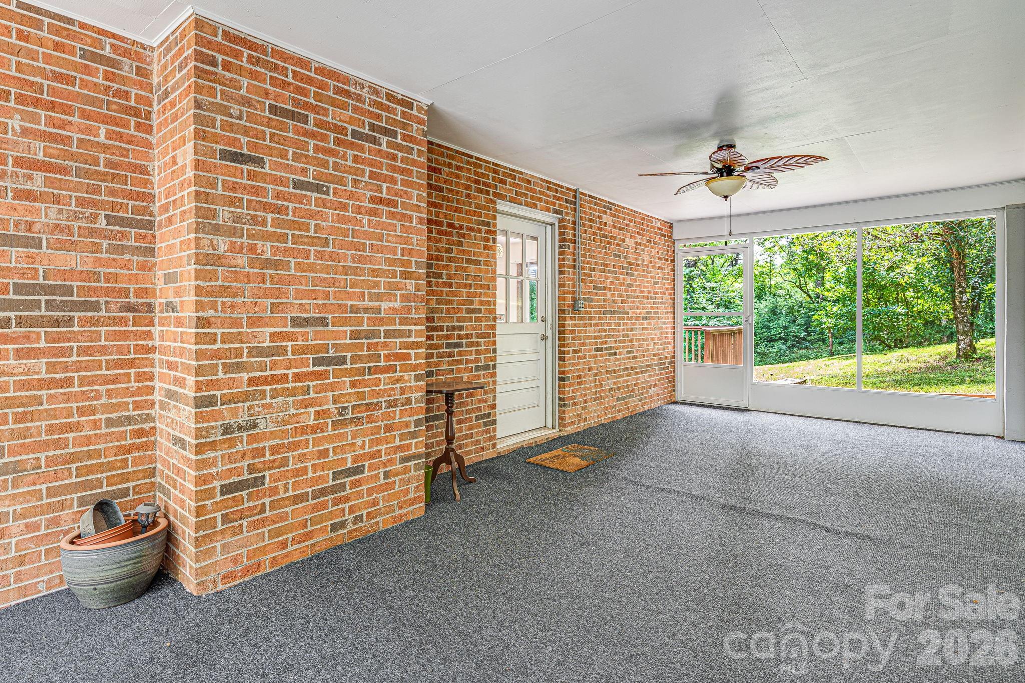 61 Spring Cove Drive Brevard, NC 28712 - Photo 4 of 39 a view of livingroom with furniture staircase and windows