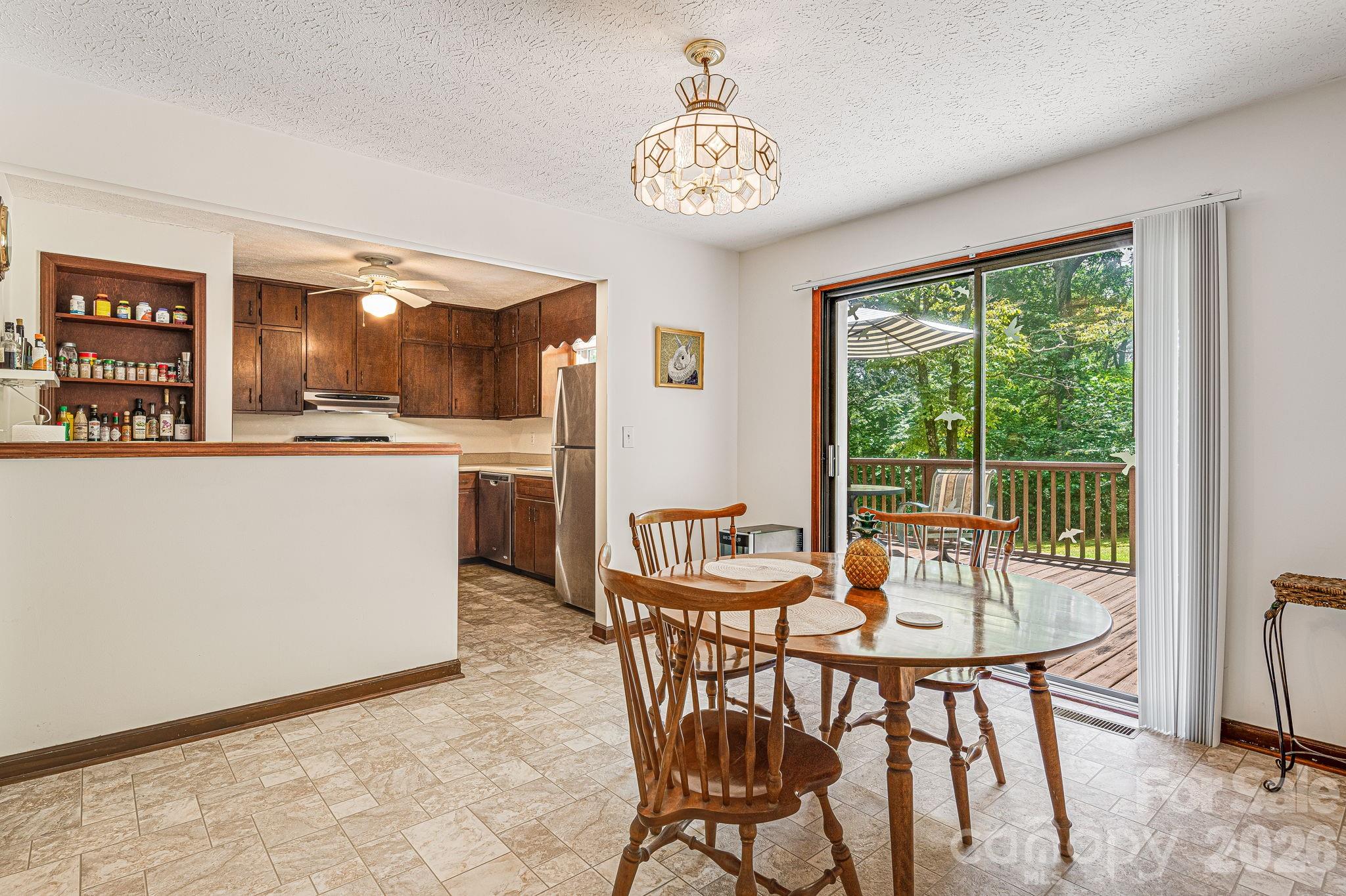 61 Spring Cove Drive Brevard, NC 28712 - Photo 9 of 39 a dining room with furniture and window