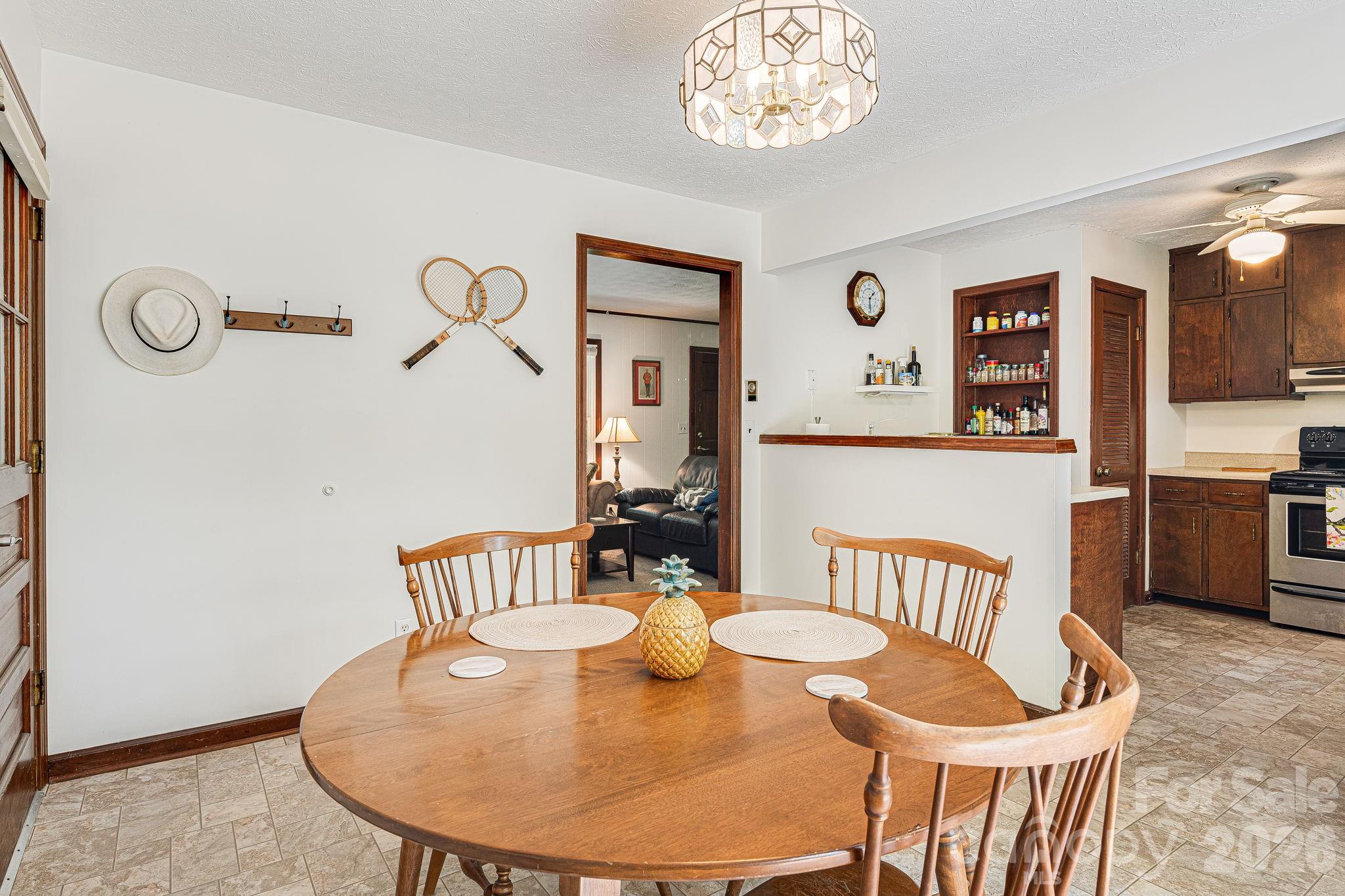 61 Spring Cove Drive Brevard, NC 28712 - Photo 10 of 39 a view of a dining room with furniture