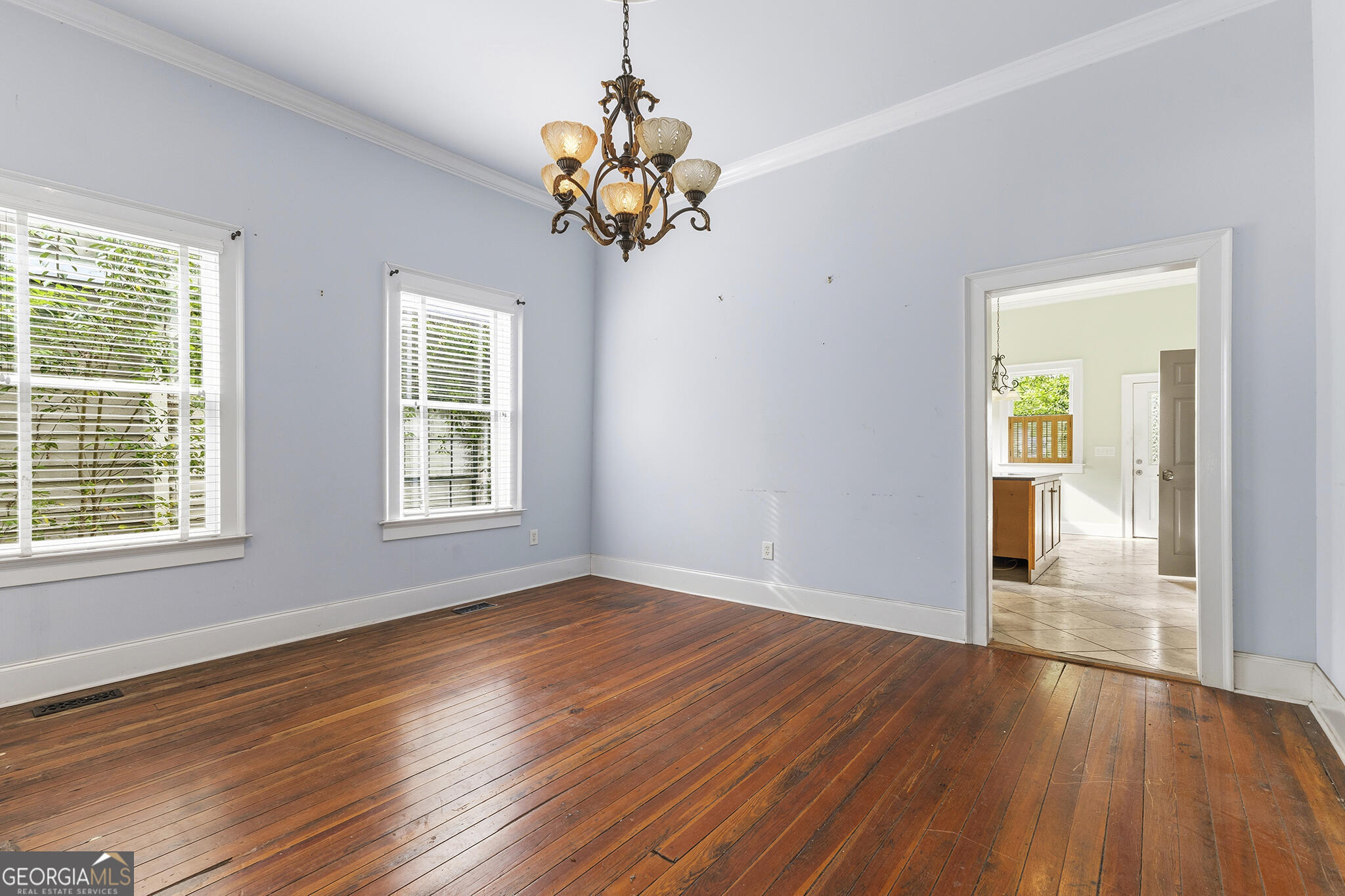 1469 Chestnut Street Macon, GA 31201 - Photo 17 of 26 a view of an empty room with wooden floor and a window