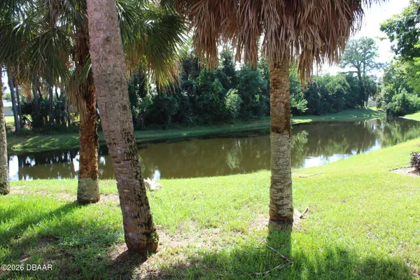 a lake view with a yard