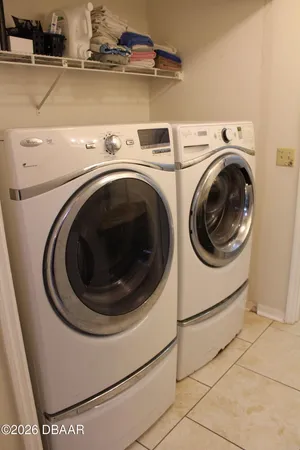 a utility room with dryer and washer
