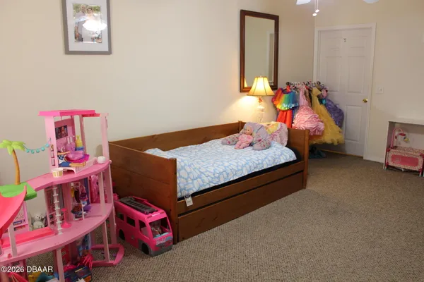 a bed room with bed and a window