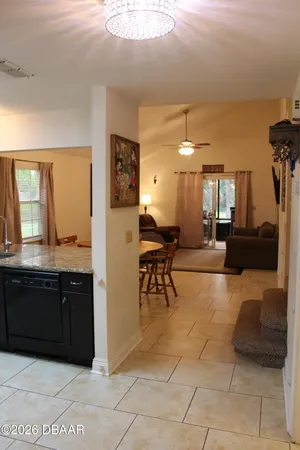 a living room with furniture a dining table and chairs