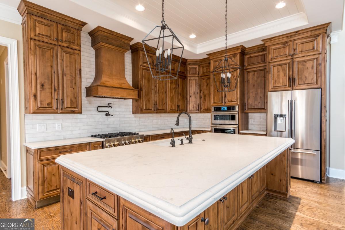 1 Cox Road Roswell, GA 30188 - Photo 33 of 38 a kitchen with a sink a stove and a refrigerator