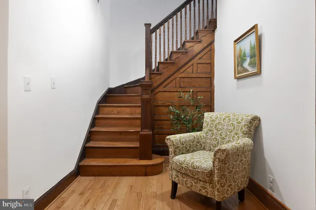 a bedroom with a bed and a flat tv screen on a dresser