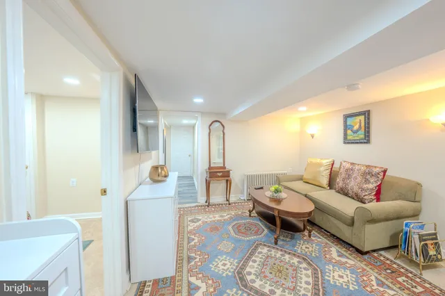 a view of a yard in front of a house with a large tree