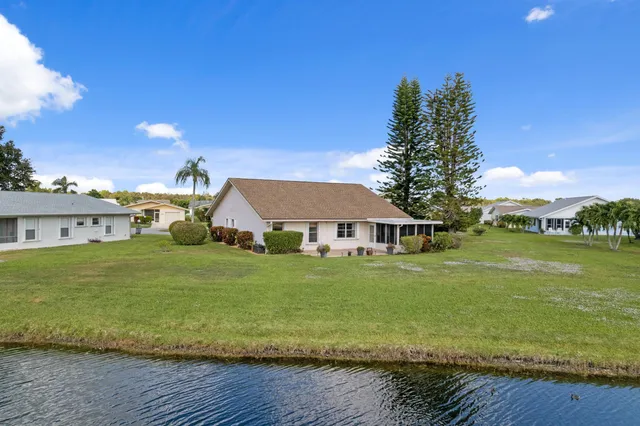 a view of lake with a patio