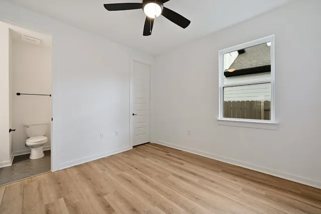 a bathroom with a sink toilet and vanity