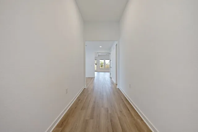 a view of a small space with wooden floor