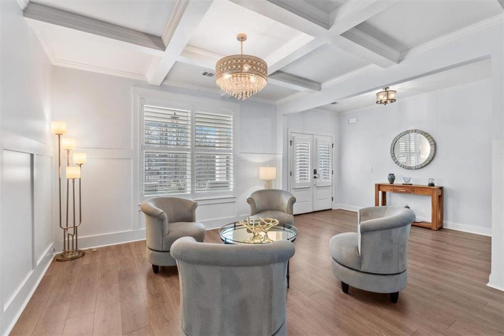7705 Wandering Oak Way Cumming, GA 30041 - Photo 13 of 57 a living room with furniture and a large window