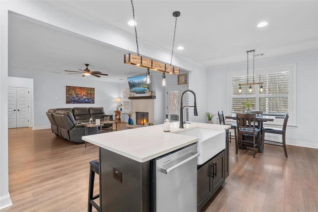 7705 Wandering Oak Way Cumming, GA 30041 - Photo 20 of 57 a large kitchen with a table and chairs