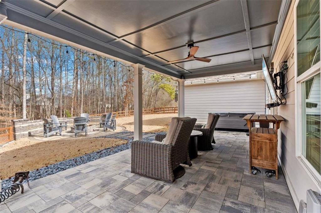 7705 Wandering Oak Way Cumming, GA 30041 - Photo 42 of 57 a dining room with furniture and large windows