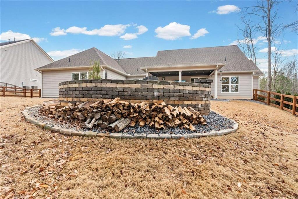 7705 Wandering Oak Way Cumming, GA 30041 - Photo 44 of 57 a view of a house with a yard