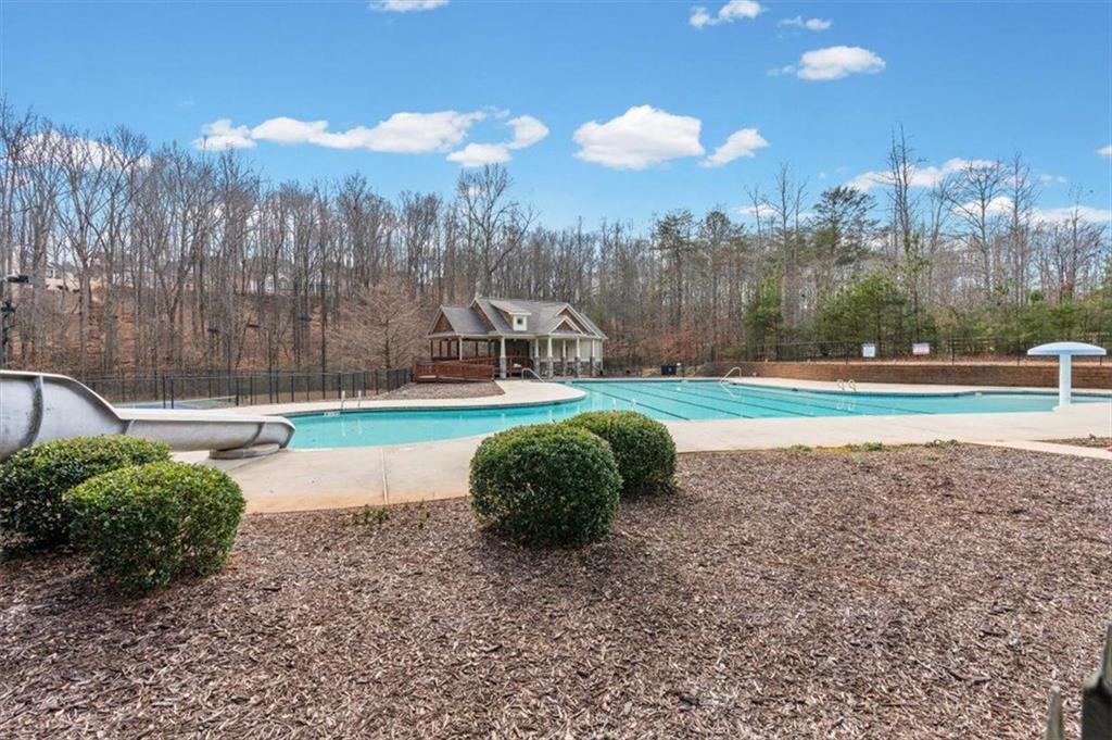 7705 Wandering Oak Way Cumming, GA 30041 - Photo 49 of 57 a view of a green field