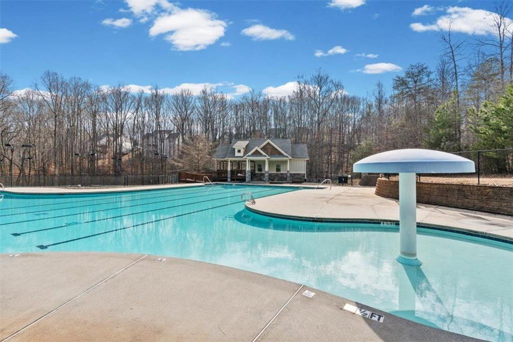 7705 Wandering Oak Way Cumming, GA 30041 - Photo 50 of 57 a view of a playground with a slide