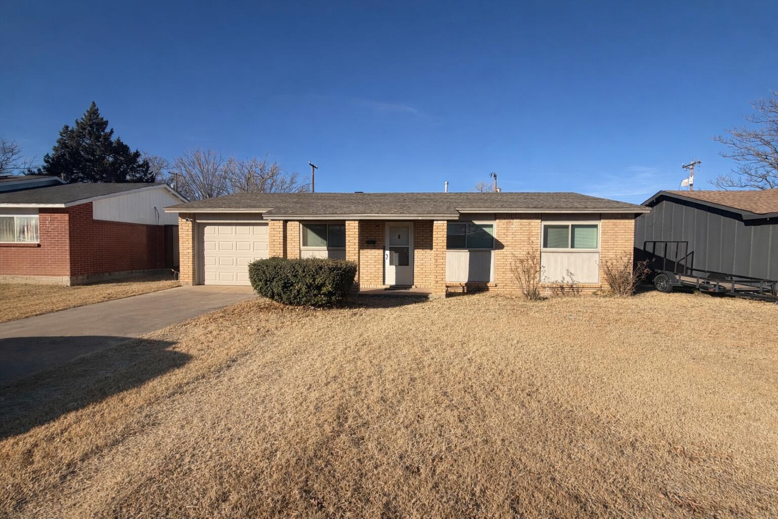 5308 48th Street Lubbock, TX 79414 - Photo 2 of 12 a front view of a house with a yard