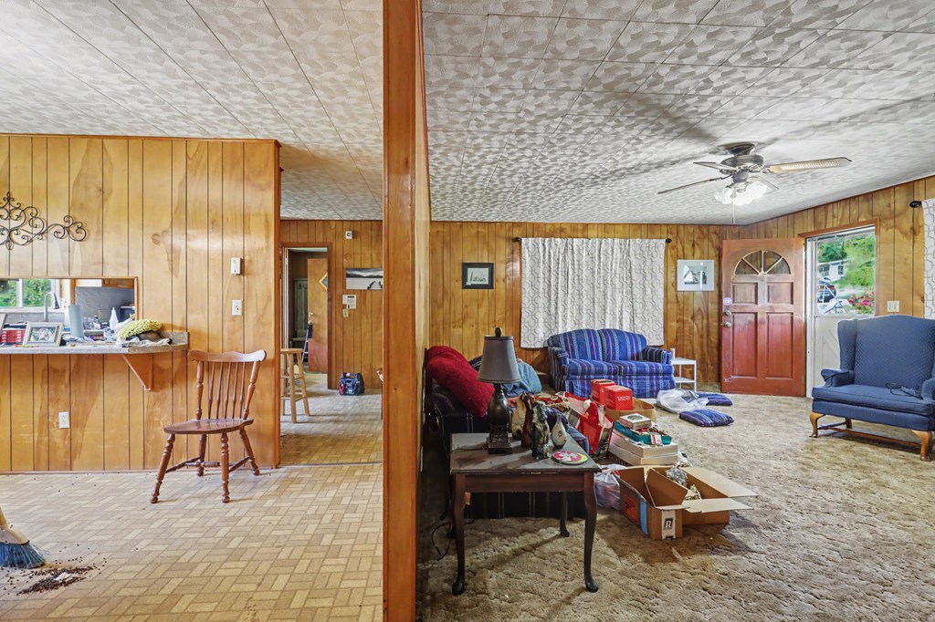 63 Fort Butler Street Murphy, NC 28906 - Photo 13 of 30 a living room filled with furniture and a chandelier
