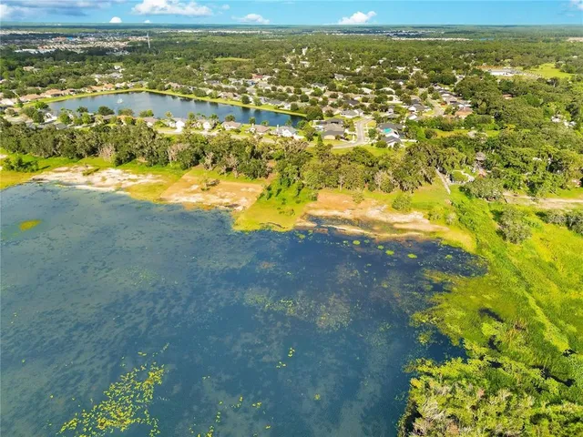 a view of a lake with a yard