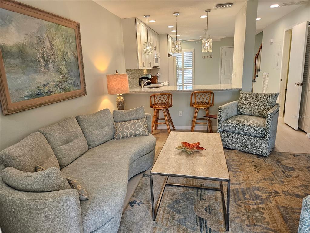 744 Cadiz Road, Unit 1 Venice, FL 34285 - Photo 25 of 46 a living room with furniture and a refrigerator