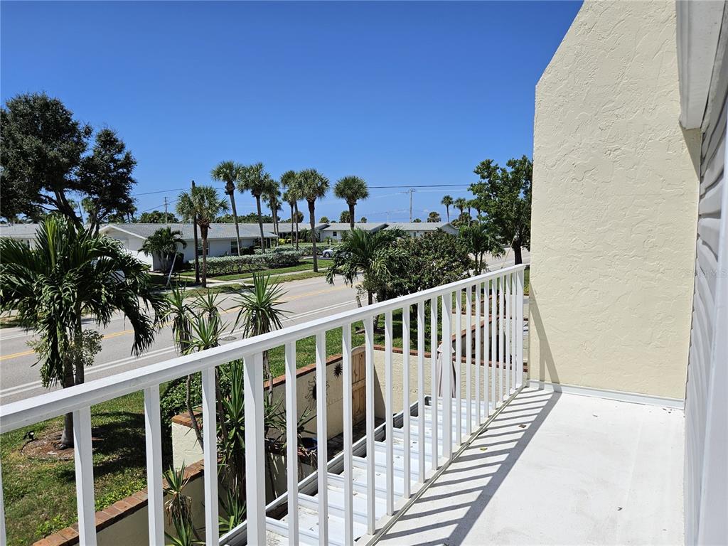 744 Cadiz Road, Unit 1 Venice, FL 34285 - Photo 33 of 46 a view of a balcony with wooden fence