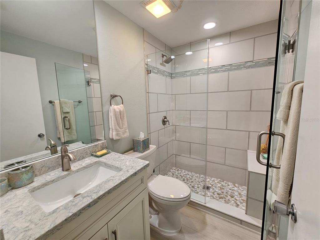 744 Cadiz Road, Unit 1 Venice, FL 34285 - Photo 39 of 46 a bathroom with a sink a toilet and shower