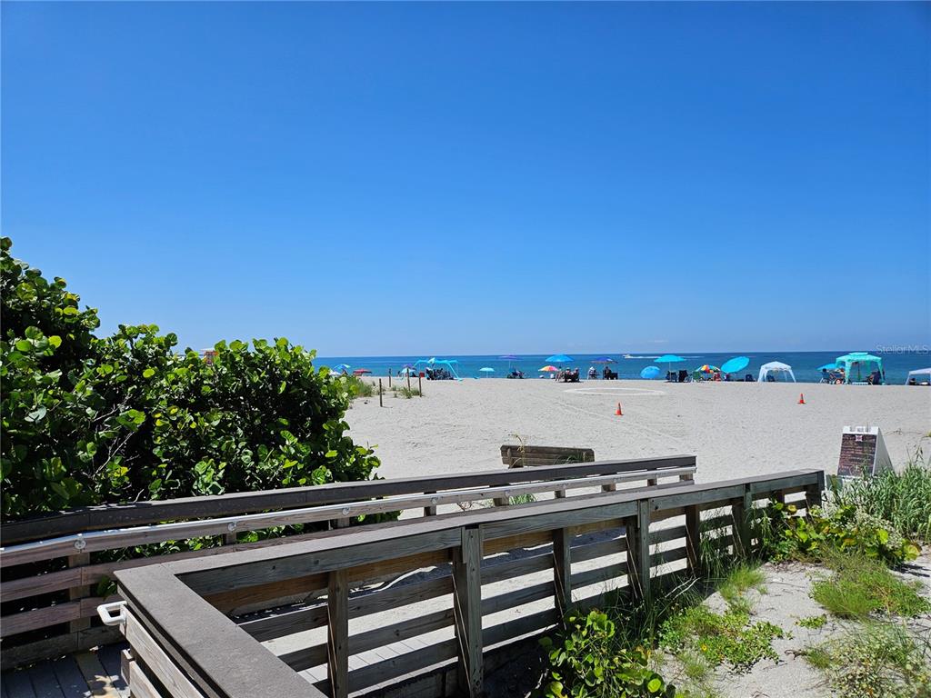 744 Cadiz Road, Unit 1 Venice, FL 34285 - Photo 44 of 46 a view of a balcony with wooden floor and outdoor space