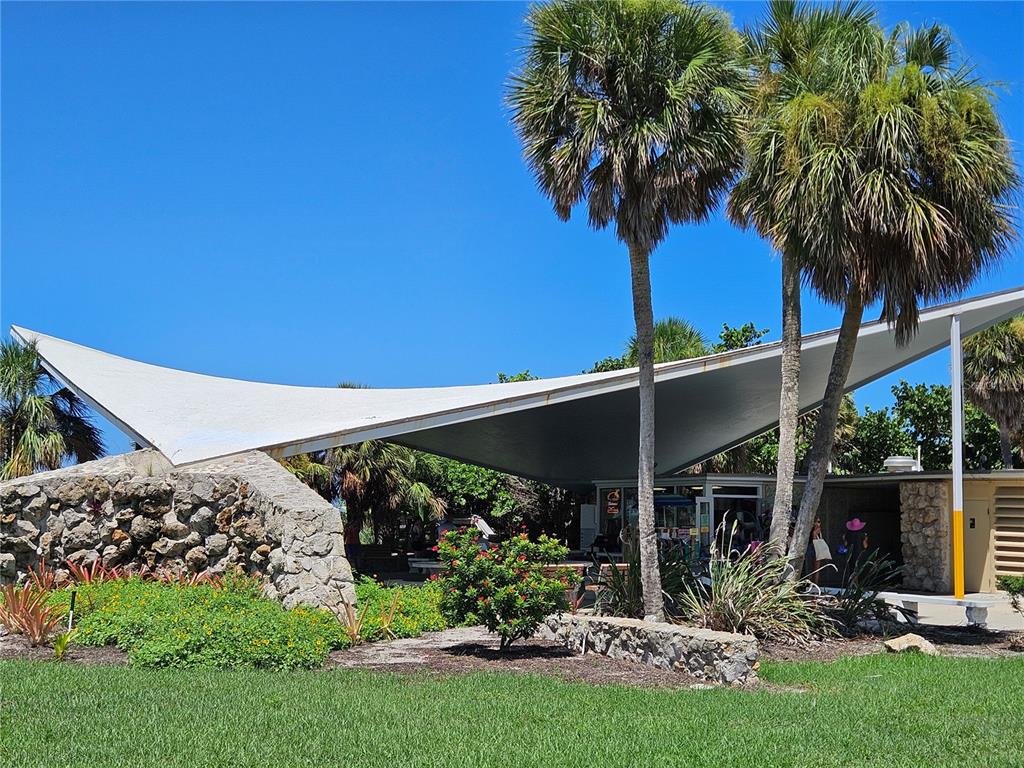 744 Cadiz Road, Unit 1 Venice, FL 34285 - Photo 46 of 46 a view of a backyard with plants and a garden