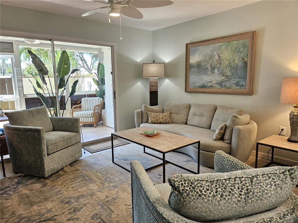 744 Cadiz Road, Unit 1 Venice, FL 34285 - Photo 6 of 46 a living room with furniture and a large window