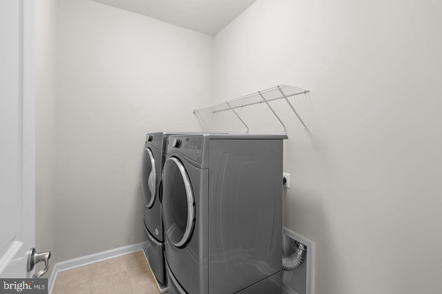 9542 Watts Road Owings Mills, MD 21117 - Photo 20 of 37 Modern laundry space with sleek appliances.