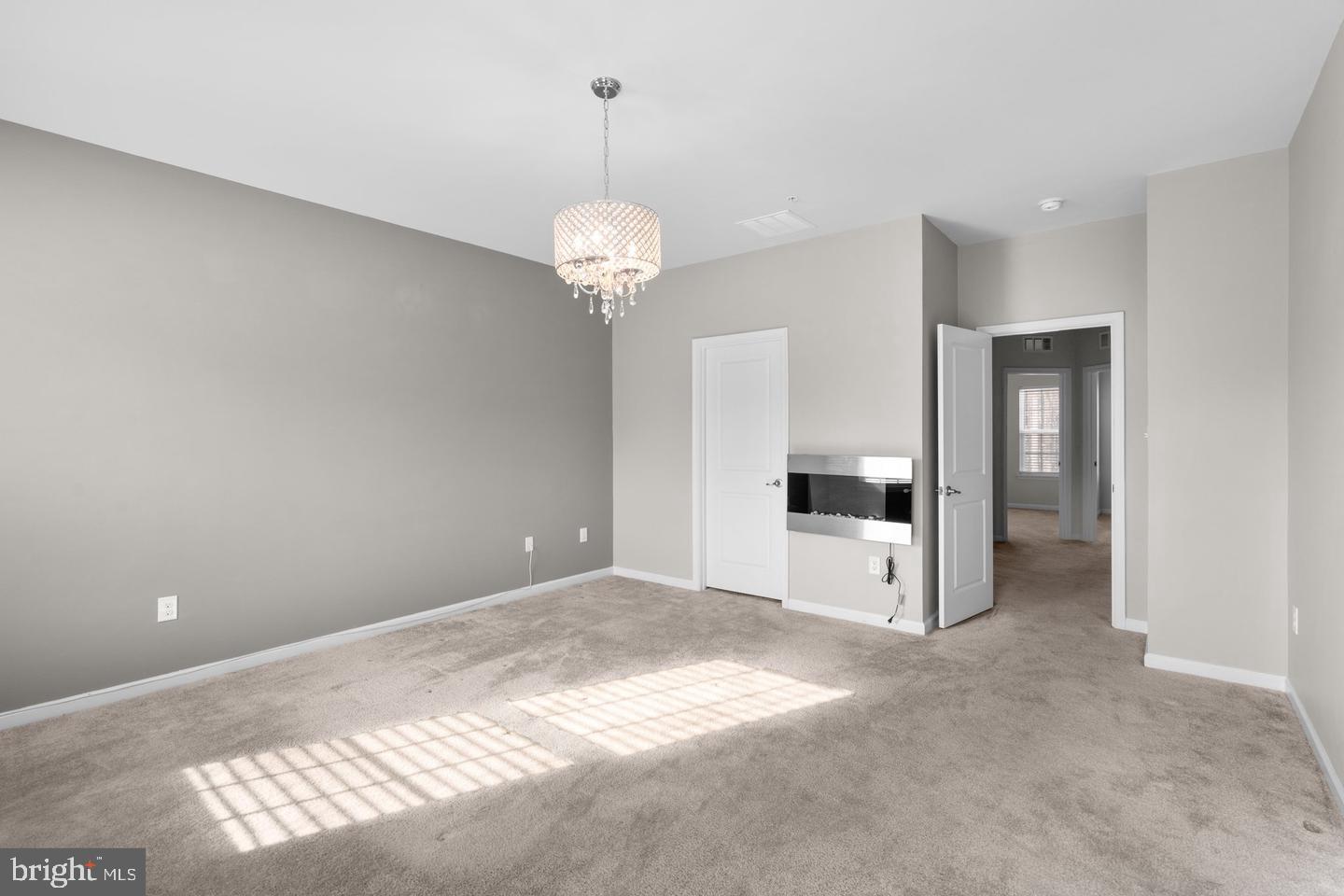 9542 Watts Road Owings Mills, MD 21117 - Photo 23 of 37 Spacious room with elegant lighting.