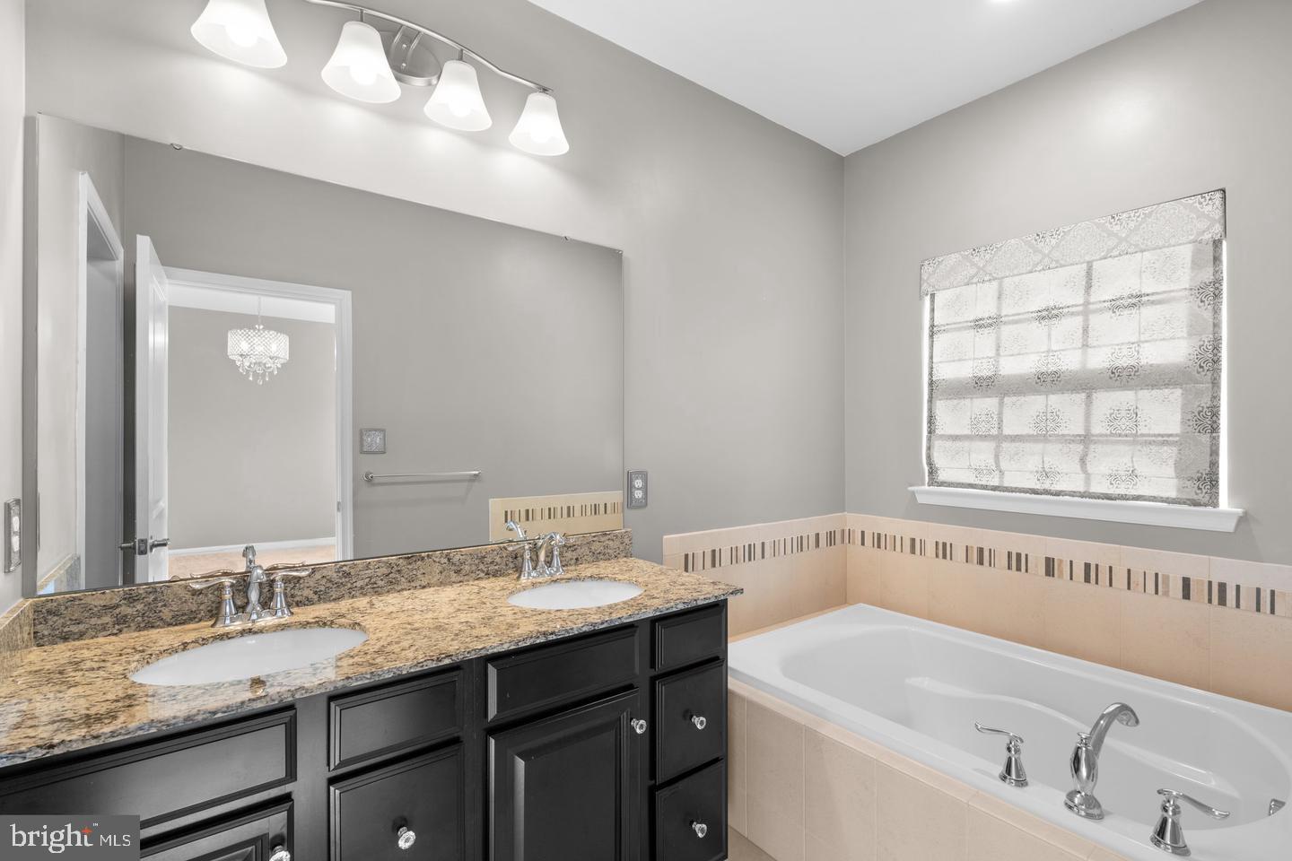 9542 Watts Road Owings Mills, MD 21117 - Photo 25 of 37 Elegant bathroom with dual sinks and tub.