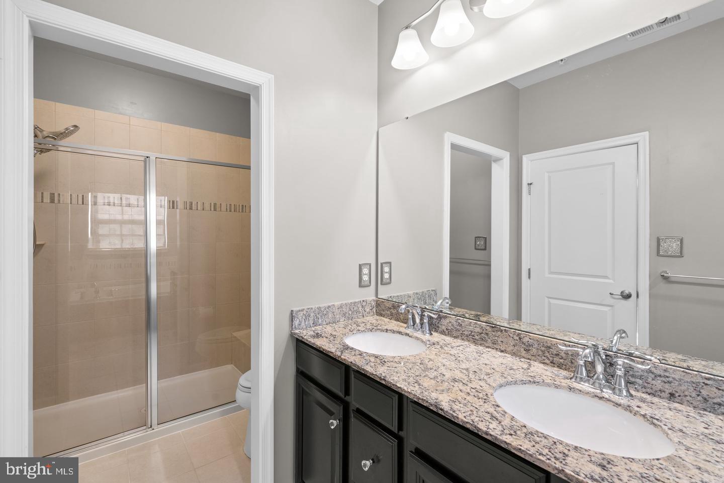 9542 Watts Road Owings Mills, MD 21117 - Photo 26 of 37 Elegant dual-sink bathroom retreat.