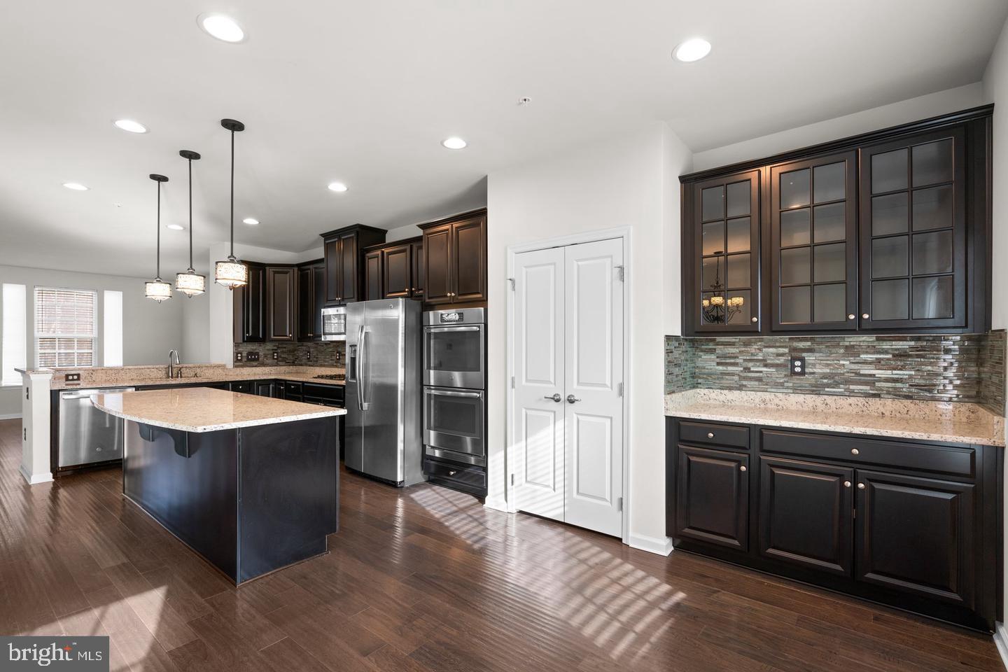 9542 Watts Road Owings Mills, MD 21117 - Photo 9 of 37 Modern kitchen with sleek cabinetry and island.
