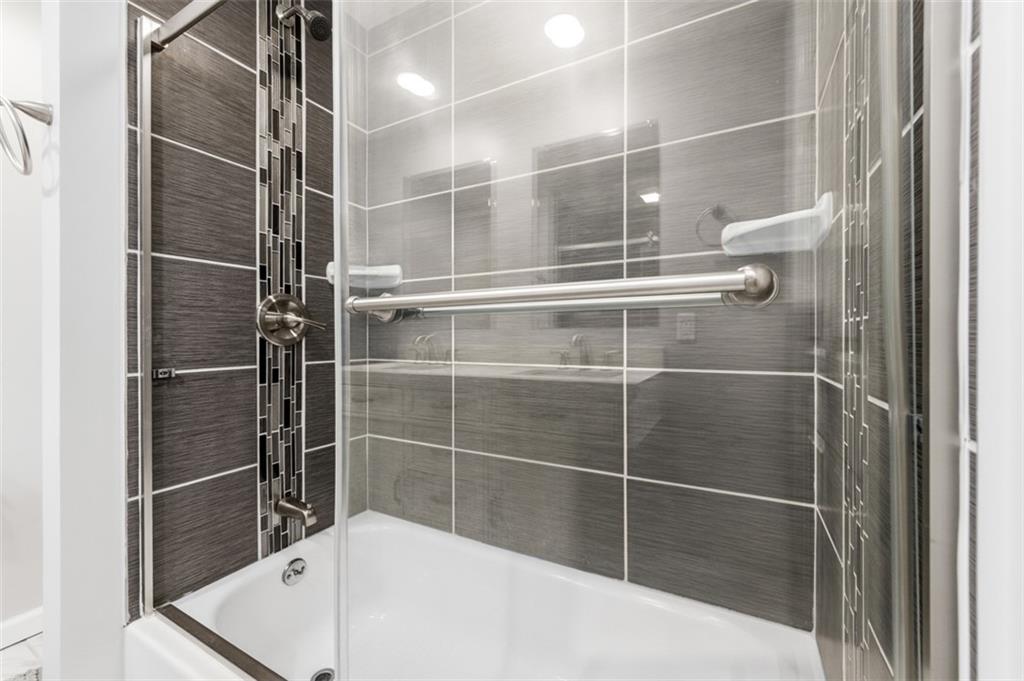 3106 Greenfield Road Glenshaw, PA 15116 - Photo 21 of 47 a bathroom with a bathtub and a shower