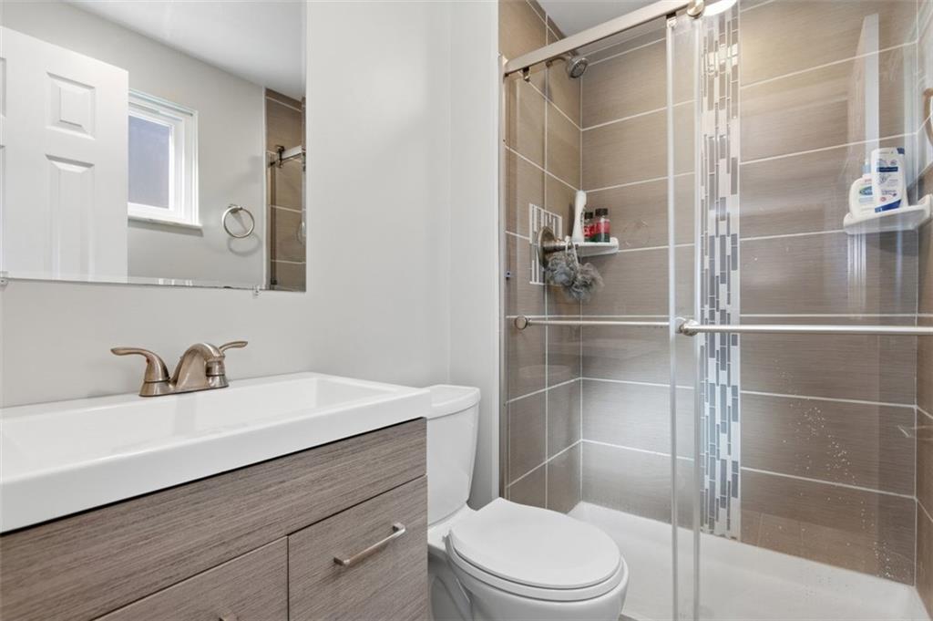 3106 Greenfield Road Glenshaw, PA 15116 - Photo 25 of 47 a bathroom with a sink toilet and shower